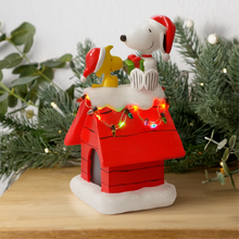 Load image into Gallery viewer, Peanuts Snoopy&#39;s Dog House Tabletop Holiday Figurine with LED Christmas Lights, 7.5 Inch
